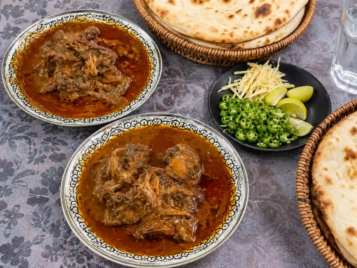 Traditional nihari served with accompaniments